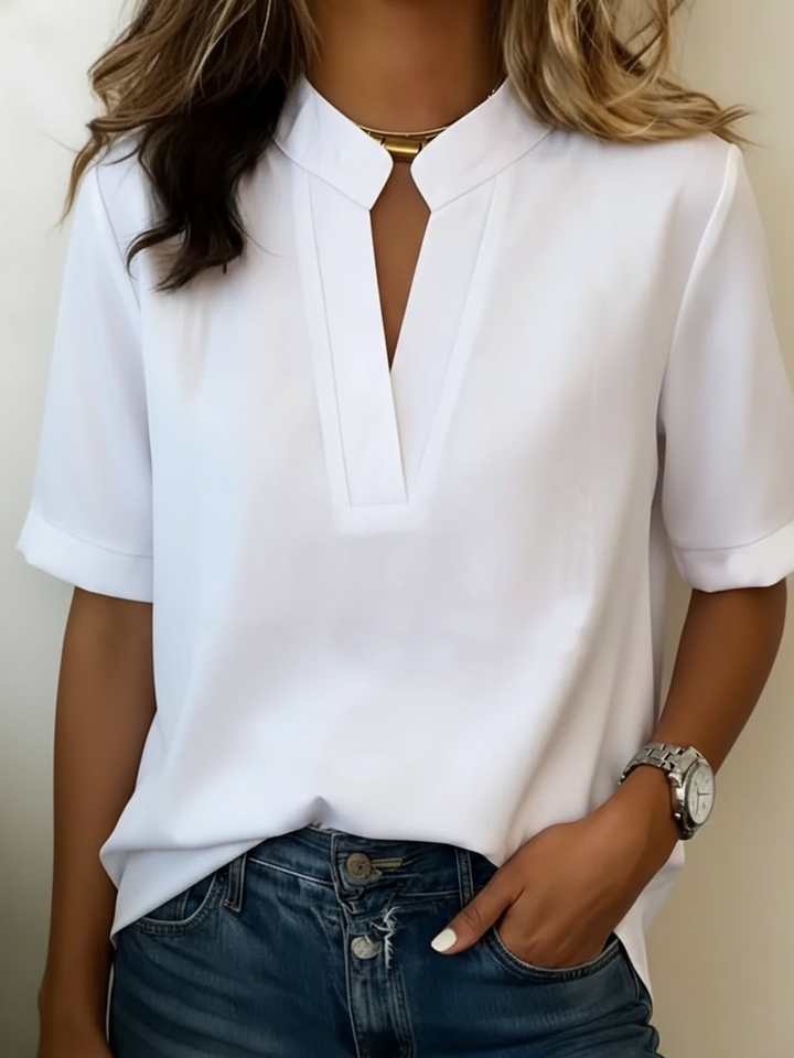 Soraya | Chic bluse med V-udskæring og gylden detalje